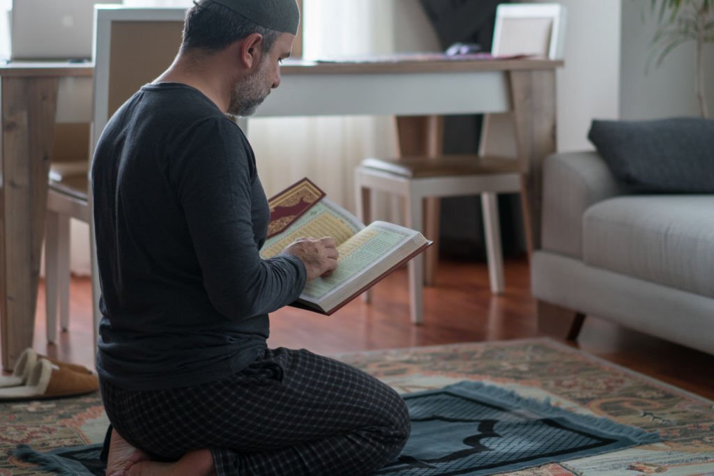 Muslim man is reading the Koran