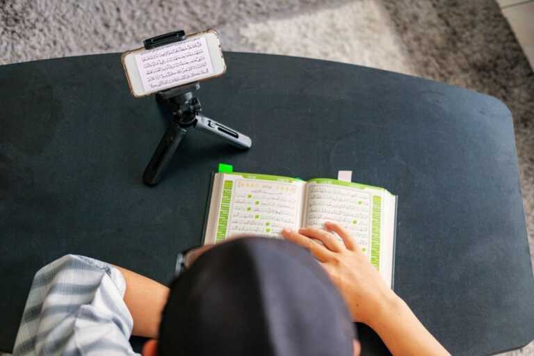 Muslim family using mobile at home during ramadhan